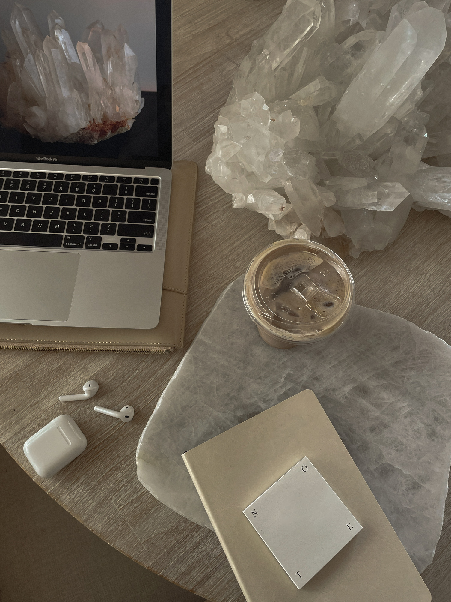 Creative workspace featuring crystals and technology for productivity and inspiration